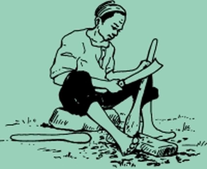 A man caving hand axe A man caving hand axe